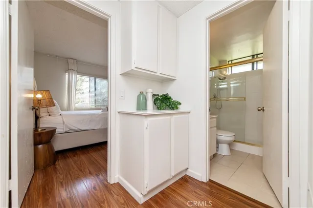 a bathroom with a toilet a sink and a mirror