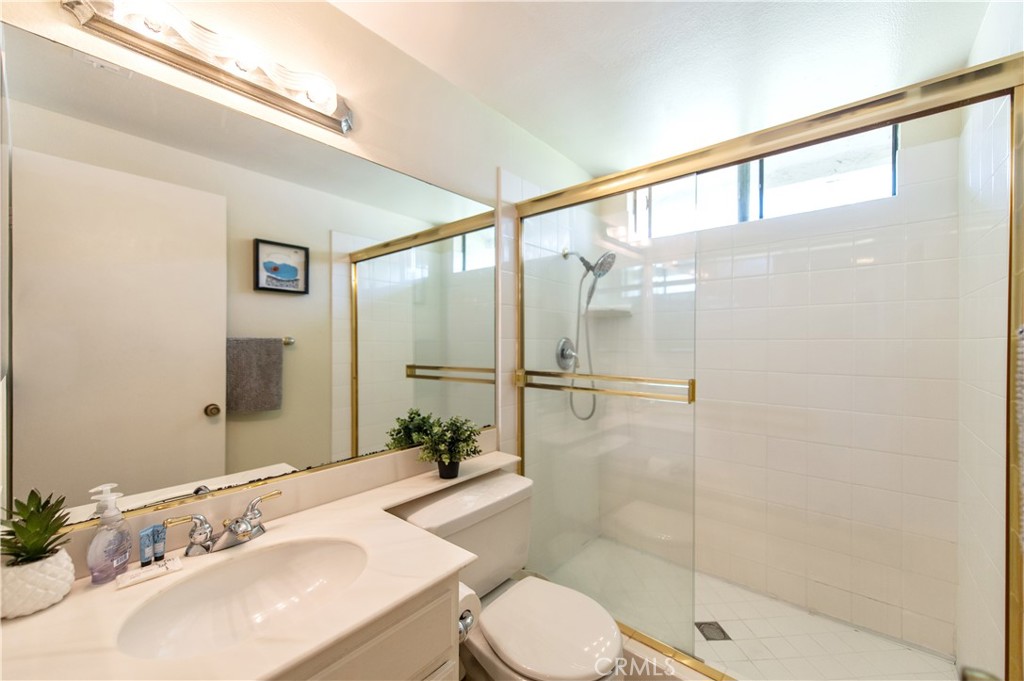 9 Morena, Unit 28 Irvine, CA 92612 - Photo 21 of 27 a bathroom with a sink and a mirror