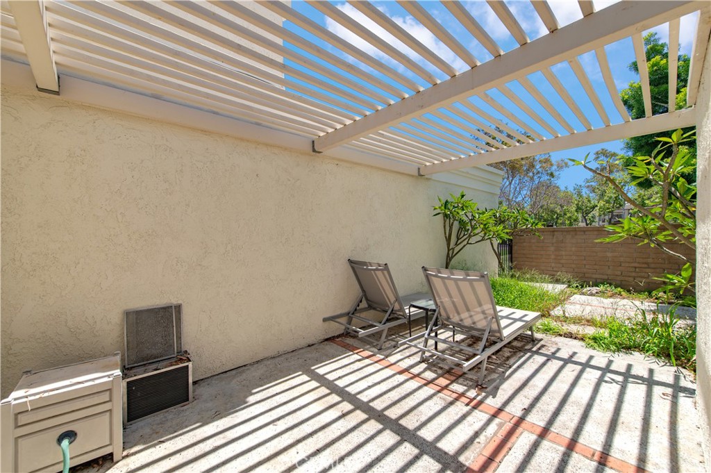 9 Morena, Unit 28 Irvine, CA 92612 - Photo 24 of 27 a view of a patio with table and chairs and potted plants