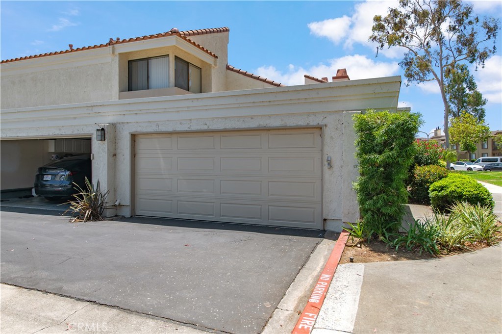 9 Morena, Unit 28 Irvine, CA 92612 - Photo 26 of 27 a view of a car garage of the house