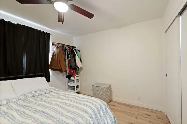 a bedroom with a bed and a walk in closet