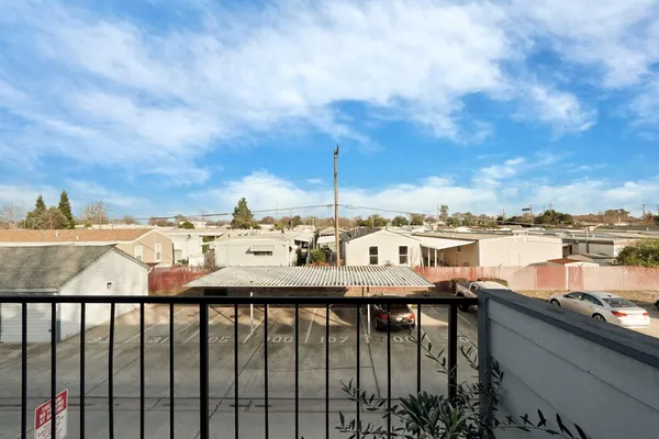 a view of a balcony with an ocean view