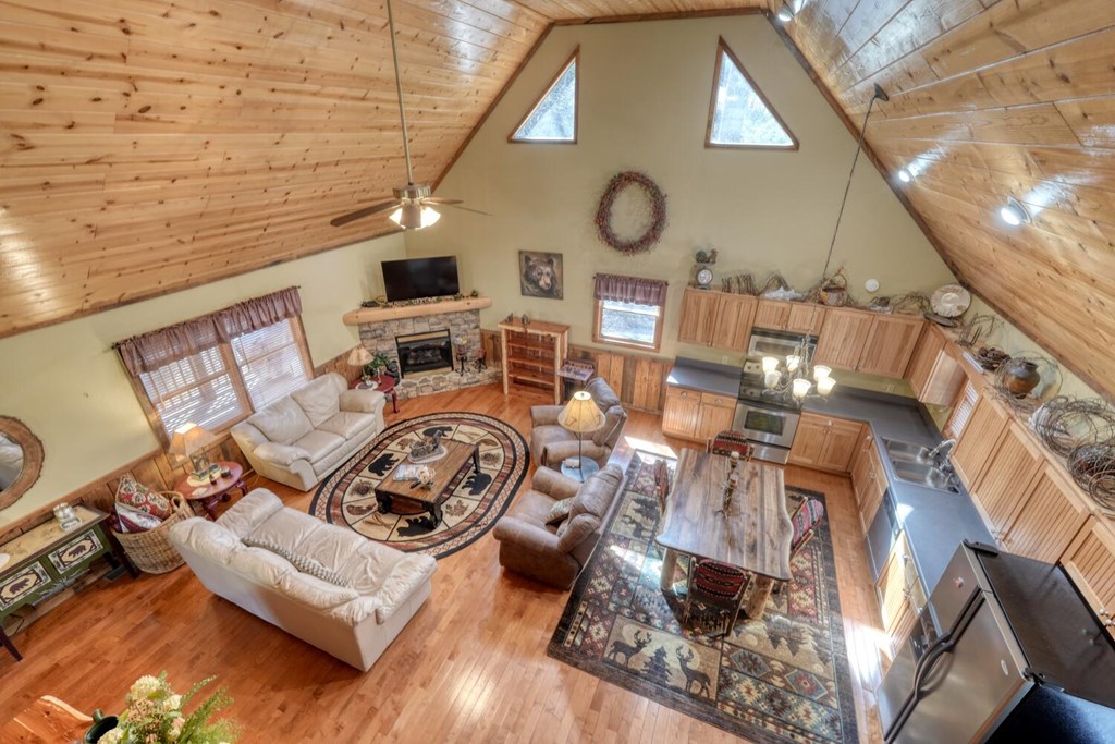 4852 Hf Lyons Road Hiawassee, GA 30546 - Photo 24 of 48 a view of living room with furniture and kitchen view