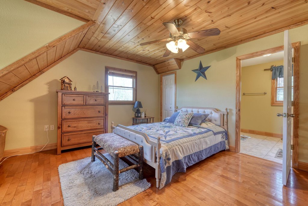 4852 Hf Lyons Road Hiawassee, GA 30546 - Photo 25 of 48 a bedroom with a bed and a table