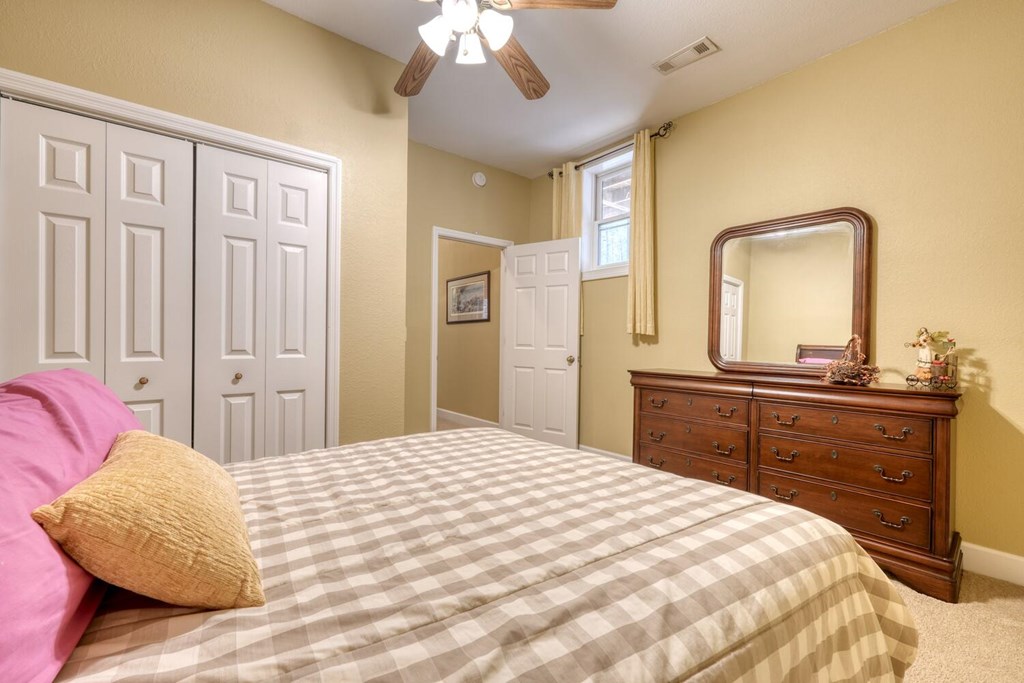 4852 Hf Lyons Road Hiawassee, GA 30546 - Photo 35 of 48 a bedroom with a bed and a dresser