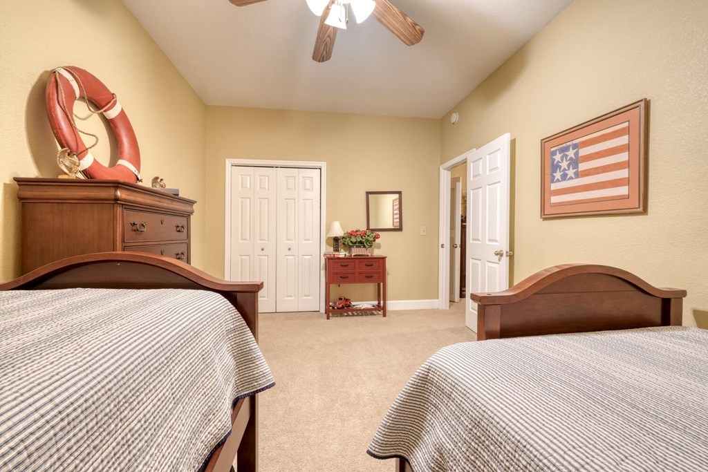 4852 Hf Lyons Road Hiawassee, GA 30546 - Photo 38 of 48 a bedroom with a bed and a chandelier