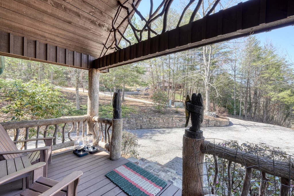 4852 Hf Lyons Road Hiawassee, GA 30546 - Photo 45 of 48 a view of a porch with wooden floor of a house