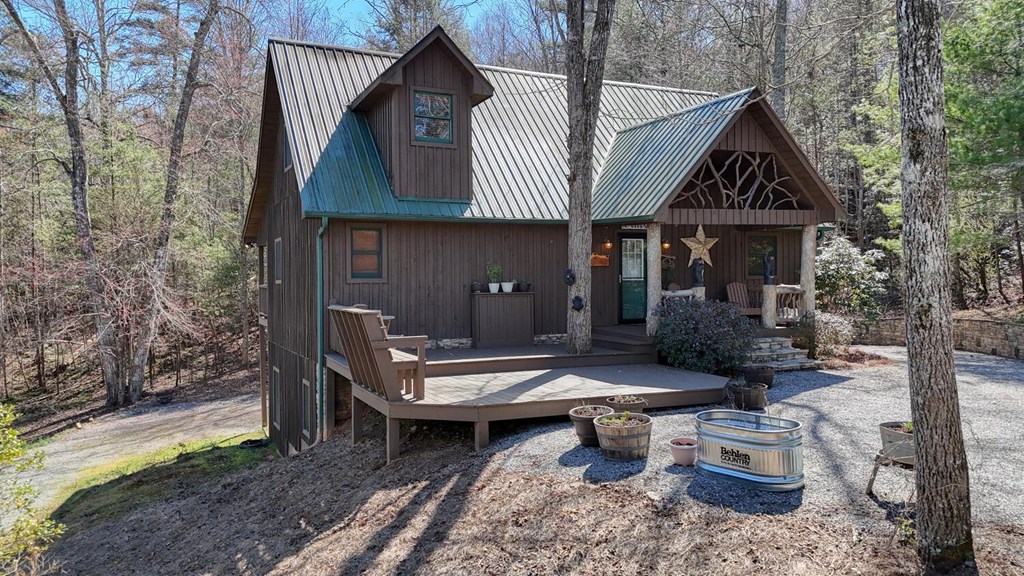 4852 Hf Lyons Road Hiawassee, GA 30546 - Photo 8 of 48 a view of a patio with table and chairs and potted plants