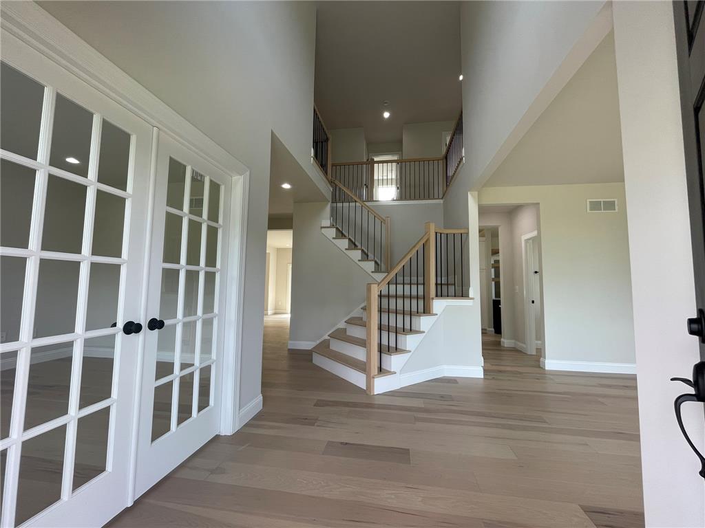 5043 Chapmans Road Orefield, PA 18069 - Photo 3 of 30 A grand two-story entryway welcomes guests with a striking staircase and light-colored wood flooring.