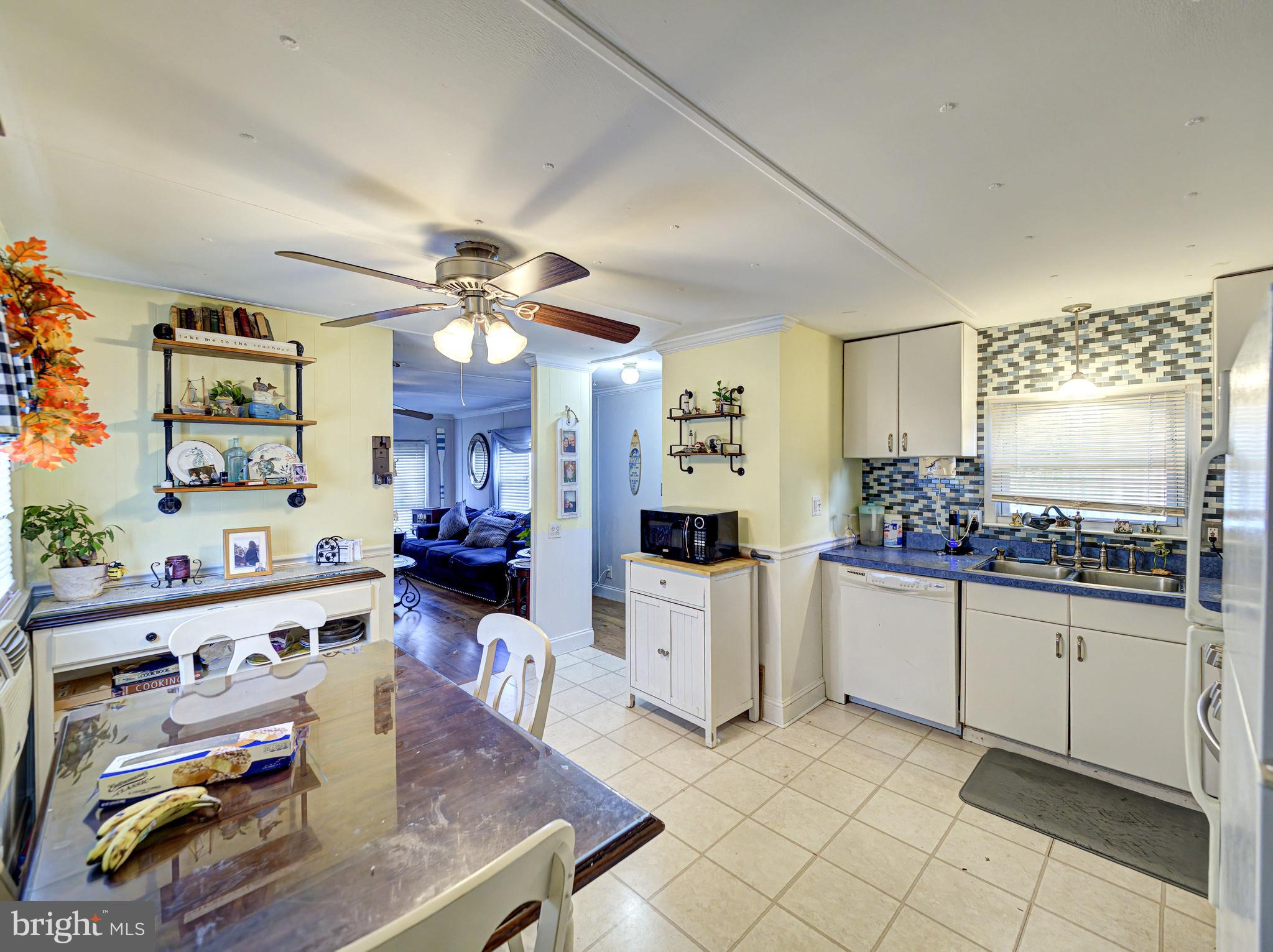 59 Bayshore Mobile Manor Hazlet, NJ 07730 - Photo 12 of 22 a view of living room kitchen and dining room