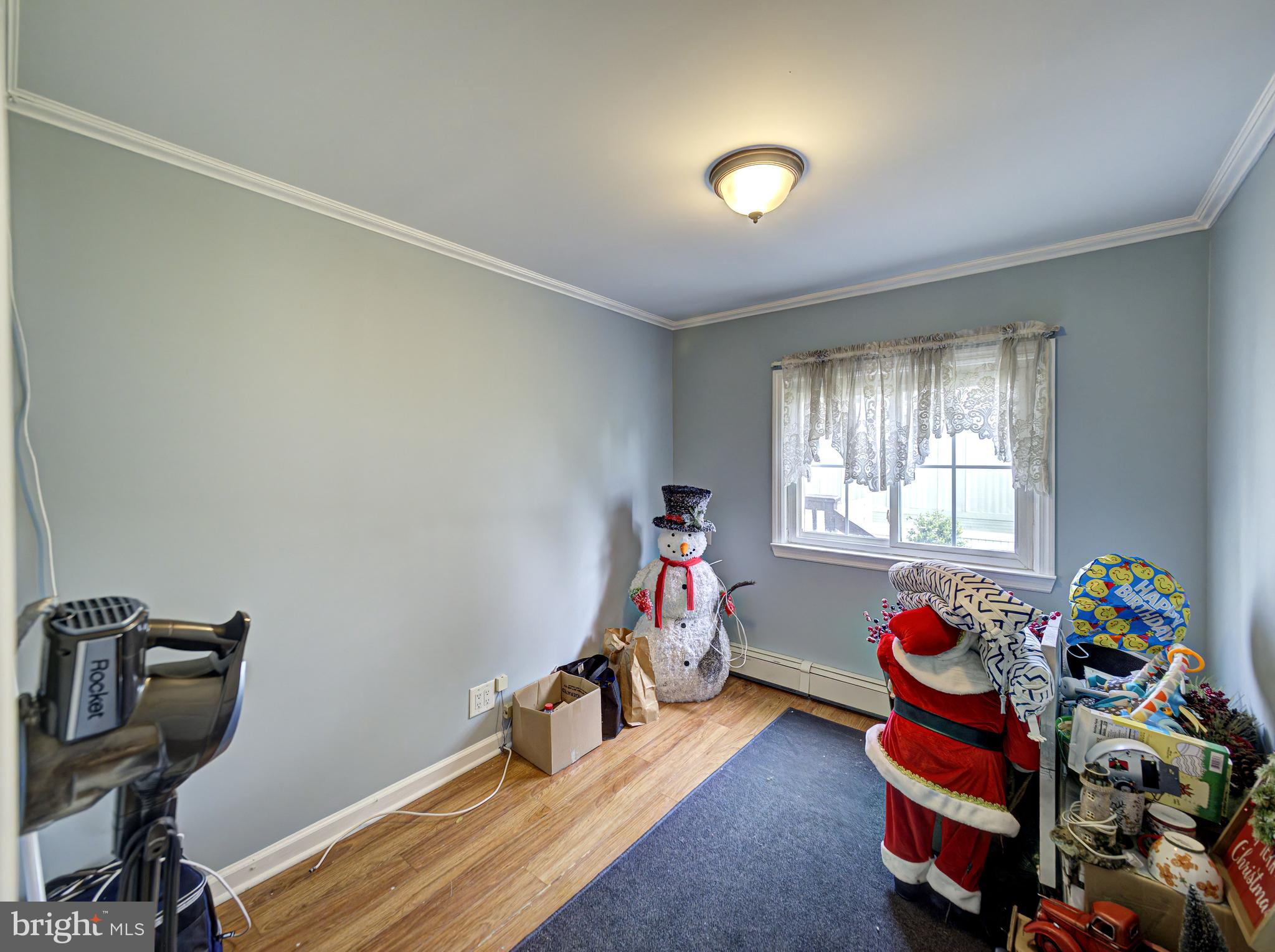 59 Bayshore Mobile Manor Hazlet, NJ 07730 - Photo 13 of 22 a room with gym equipment and a window