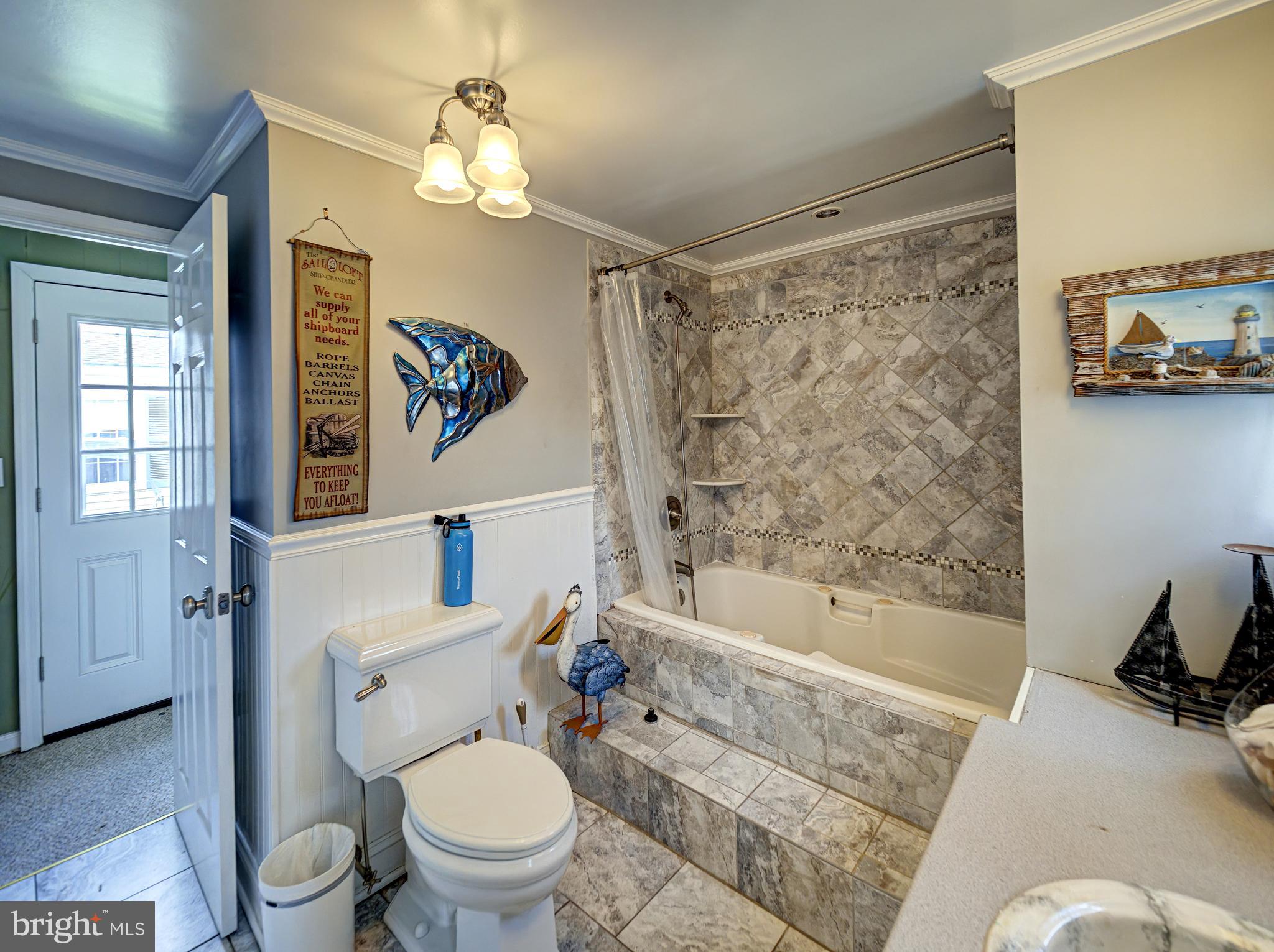 59 Bayshore Mobile Manor Hazlet, NJ 07730 - Photo 17 of 22 a bathroom with a toilet a sink and a bathtub