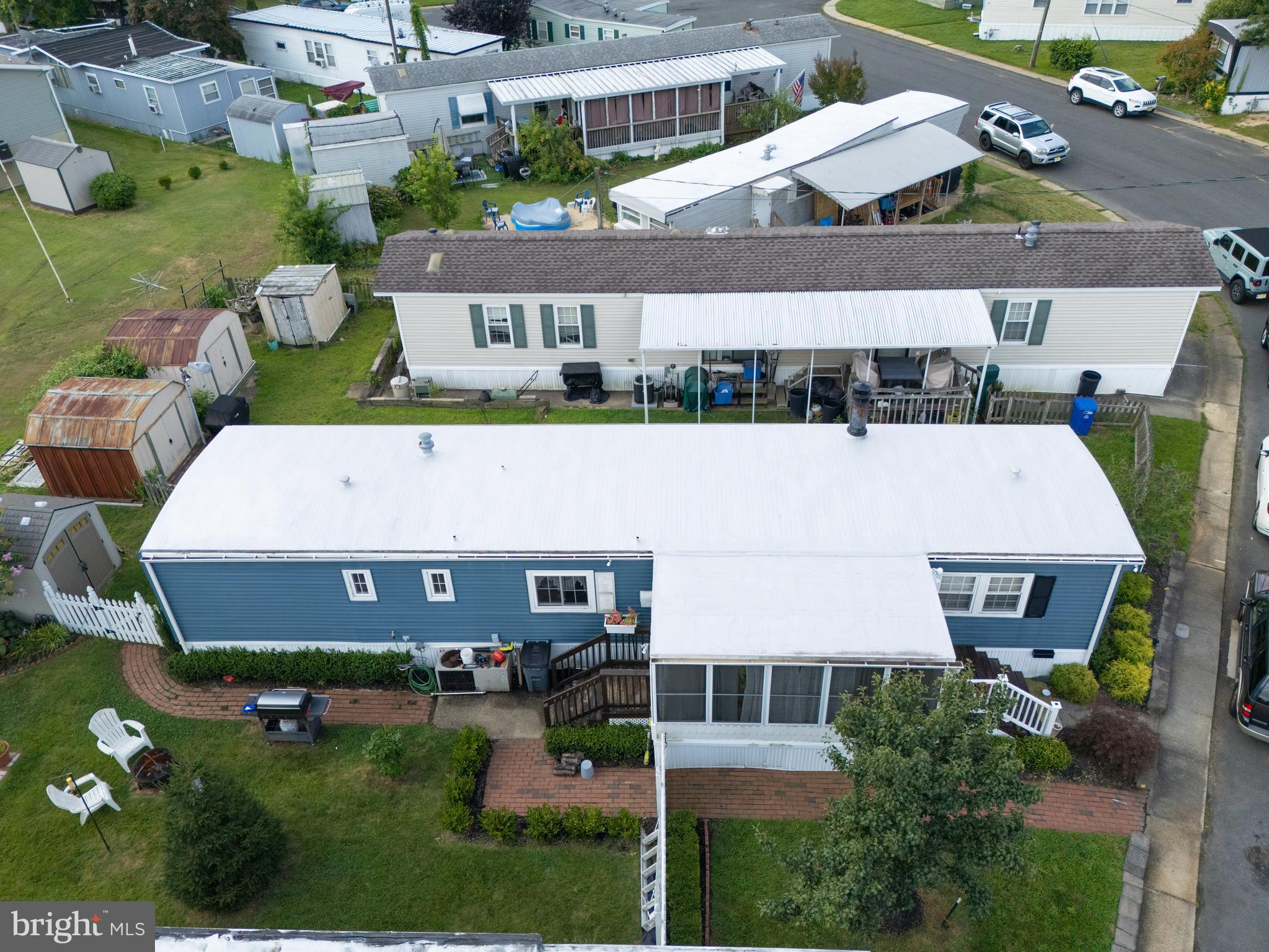 59 Bayshore Mobile Manor Hazlet, NJ 07730 - Photo 2 of 22 a aerial view of a house with a swimming pool