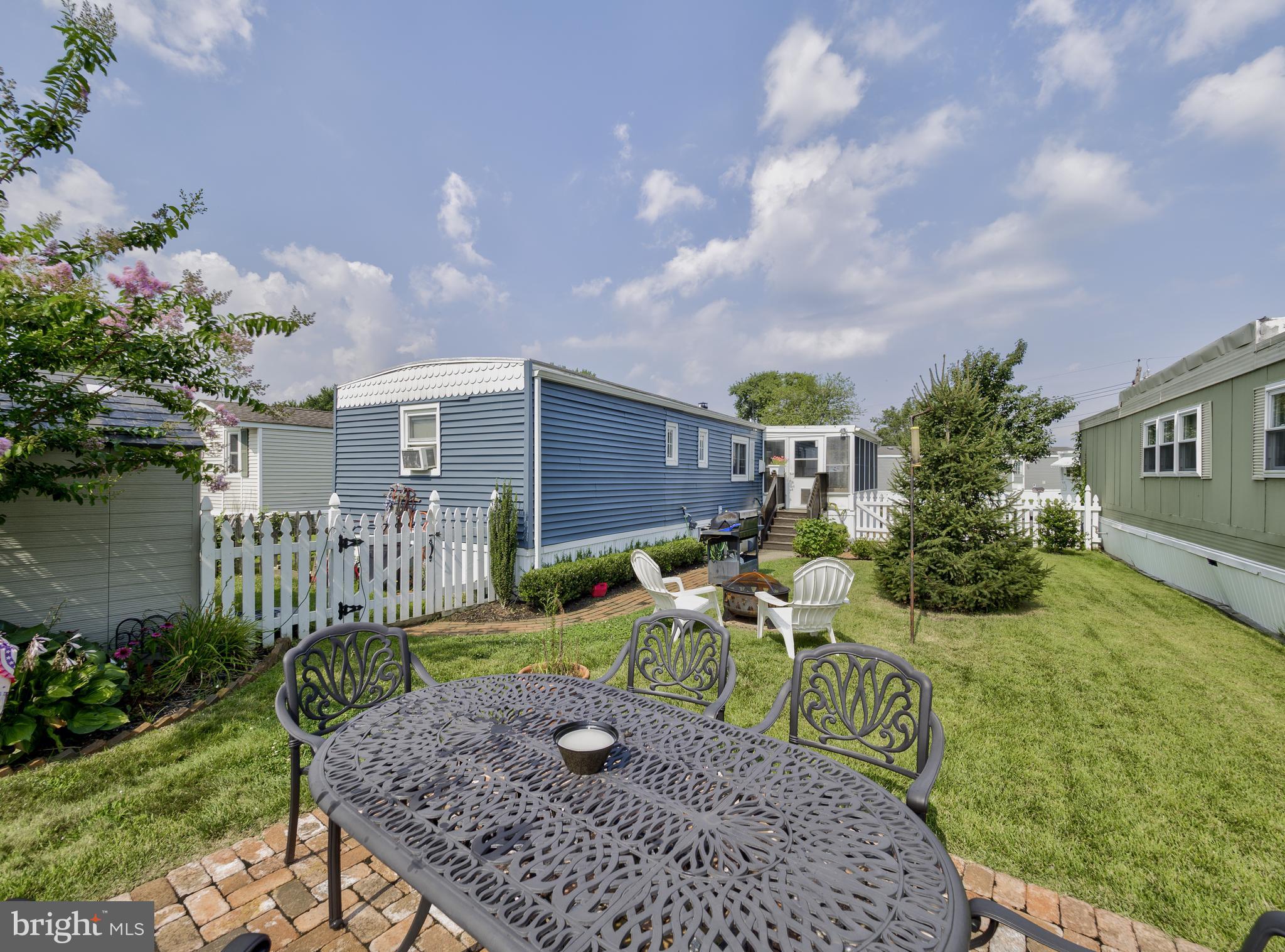 59 Bayshore Mobile Manor Hazlet, NJ 07730 - Photo 6 of 22 a front view of a house with garden