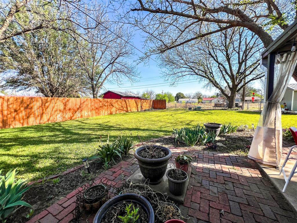 1009 North 7th Street Haskell, TX 79521 - Photo 22 of 26 a view of a swimming pool with a garden