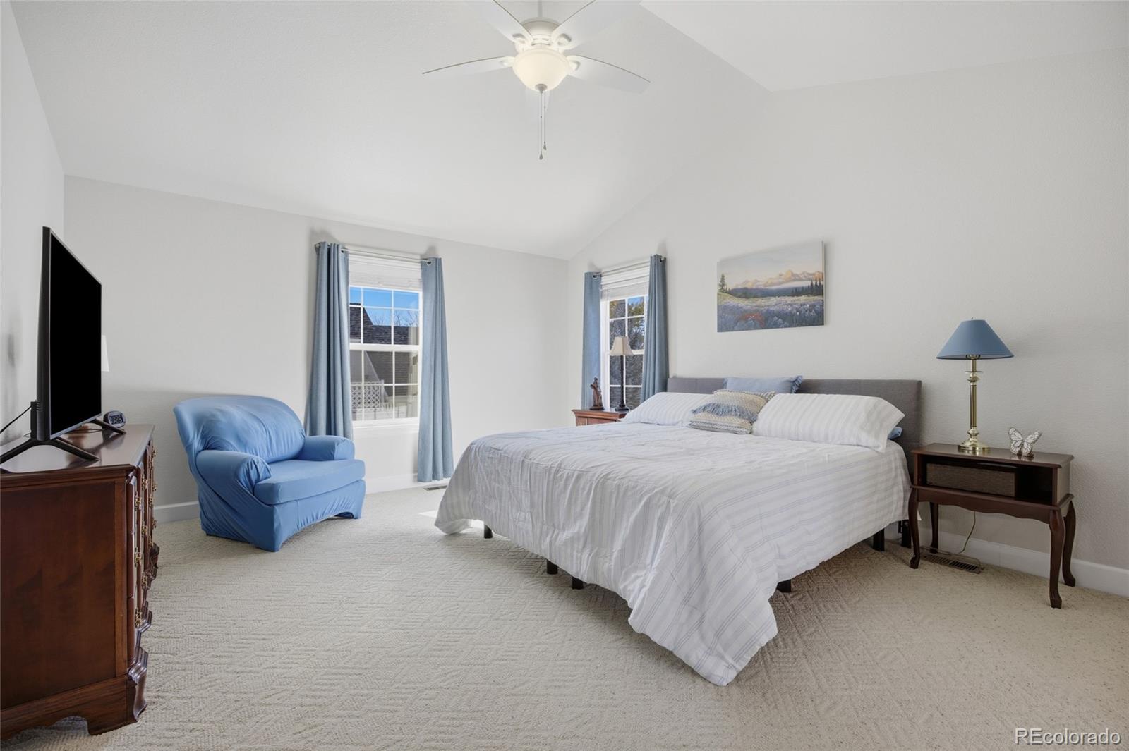 1229 Founders Circle Windsor, CO 80550 - Photo 16 of 45 a bedroom with a bed and a couch