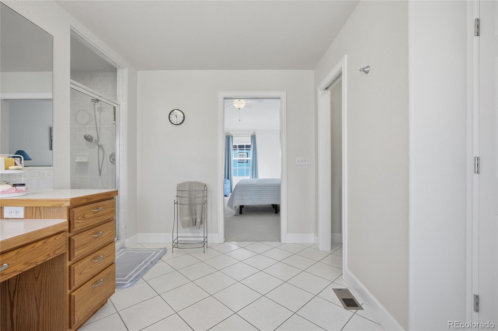 1229 Founders Circle Windsor, CO 80550 - Photo 20 of 45 a bedroom with a bed and a cabinets