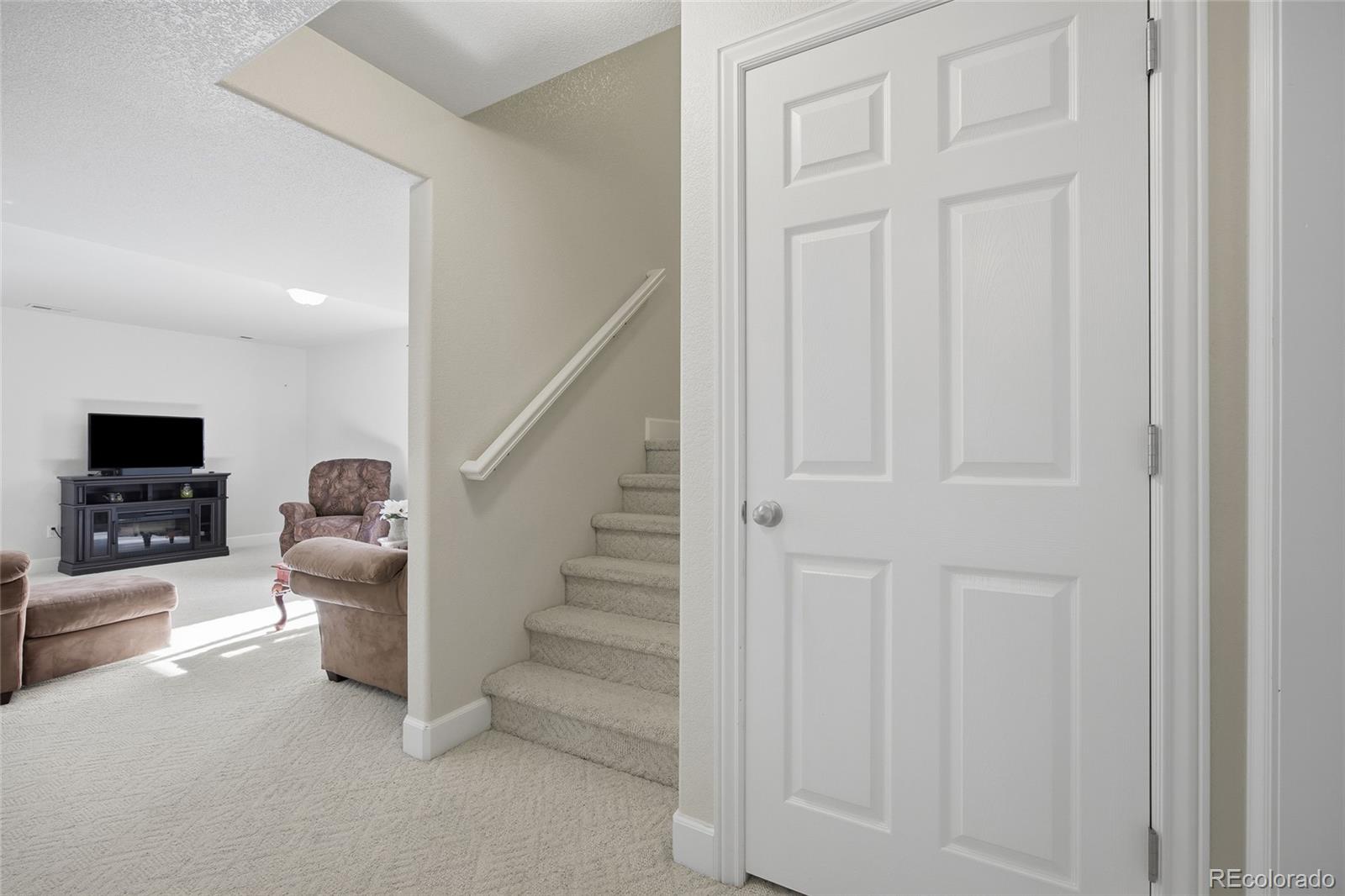 1229 Founders Circle Windsor, CO 80550 - Photo 26 of 45 a view of entryway and livingroom with furniture