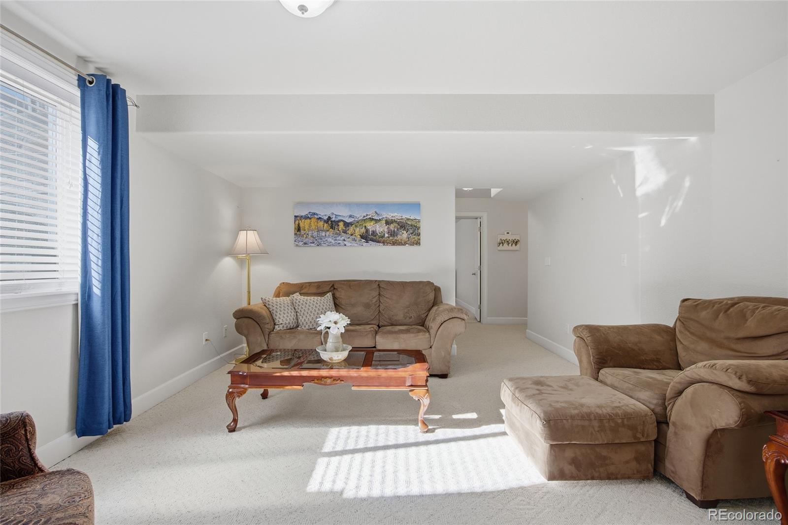 1229 Founders Circle Windsor, CO 80550 - Photo 28 of 45 a living room with furniture and a couch