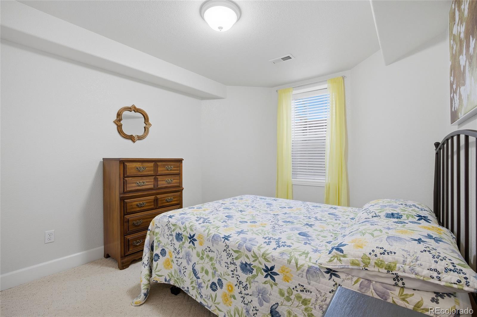 1229 Founders Circle Windsor, CO 80550 - Photo 33 of 45 a bedroom with a bed and a window