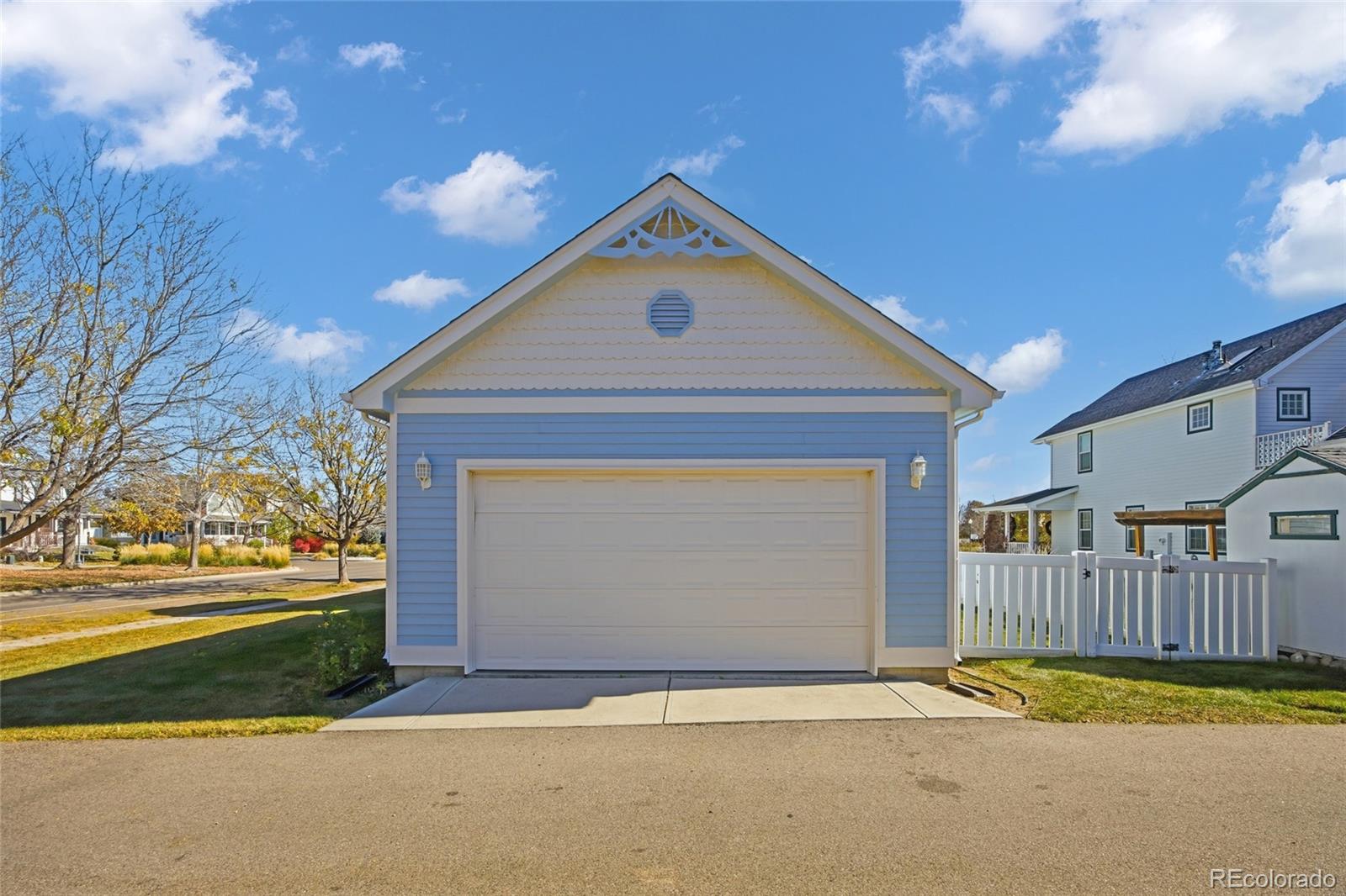 1229 Founders Circle Windsor, CO 80550 - Photo 35 of 45 a front view of a house with a yard