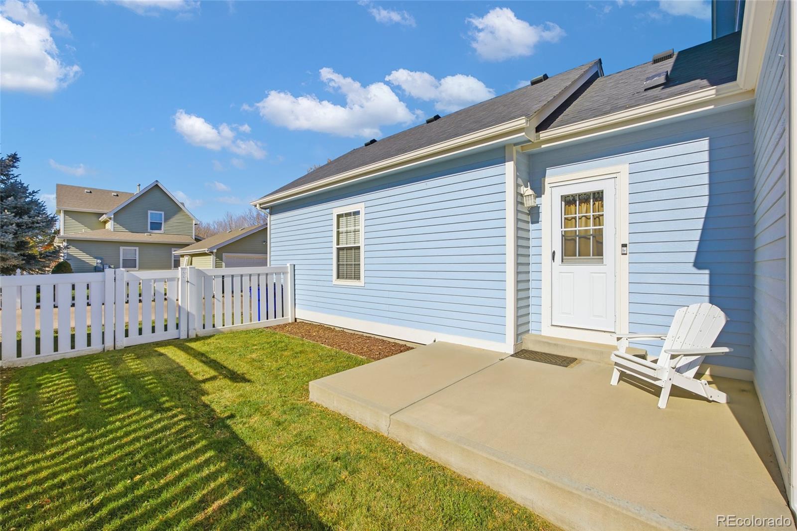 1229 Founders Circle Windsor, CO 80550 - Photo 36 of 45 a view of a backyard with a patio