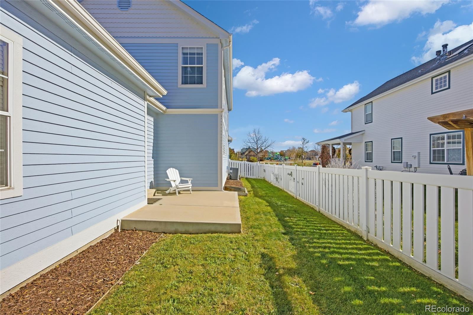 1229 Founders Circle Windsor, CO 80550 - Photo 37 of 45 a view of a house with backyard and sitting area
