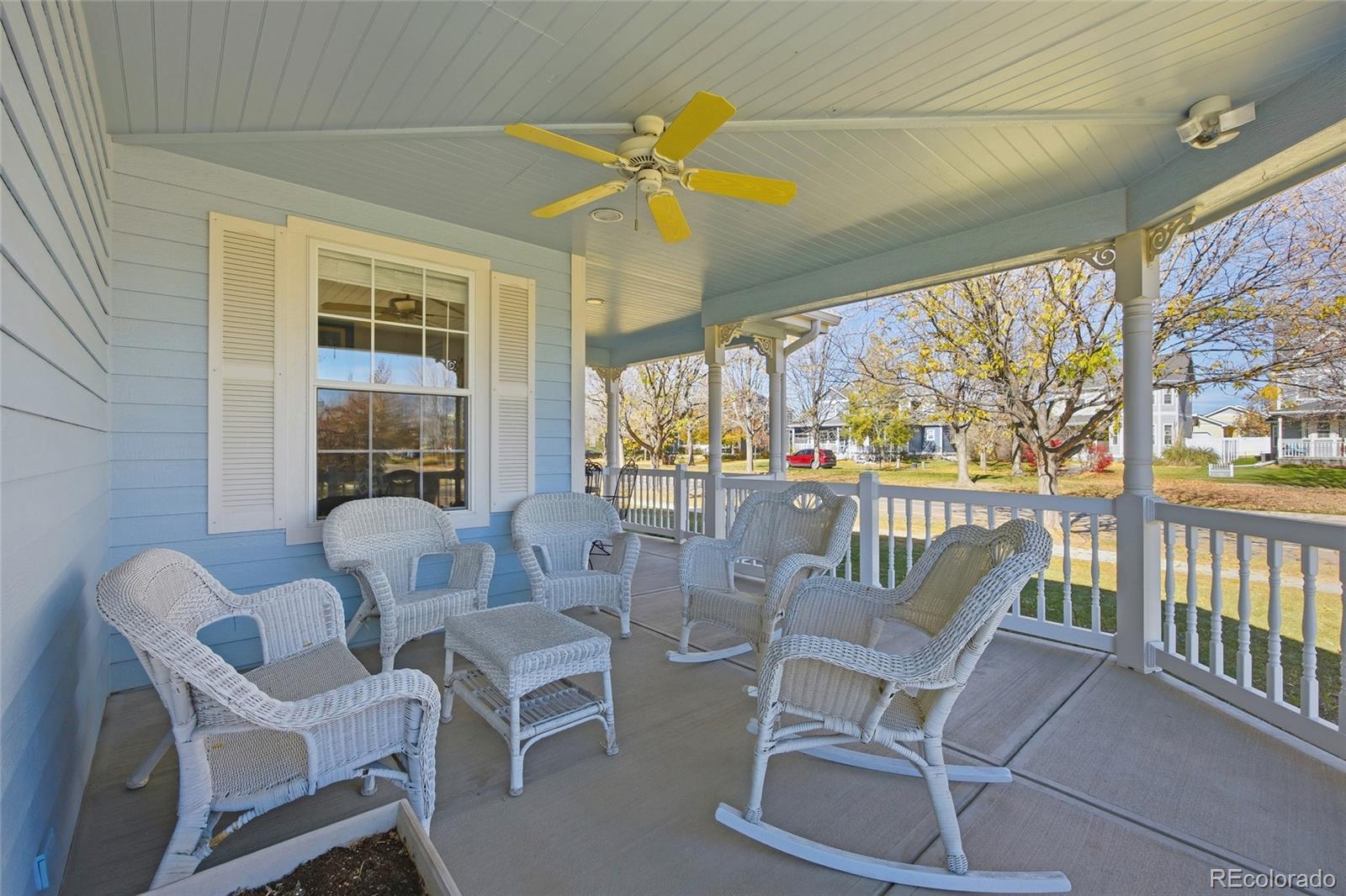 1229 Founders Circle Windsor, CO 80550 - Photo 38 of 45 a dining room with furniture large windows and a chandelier