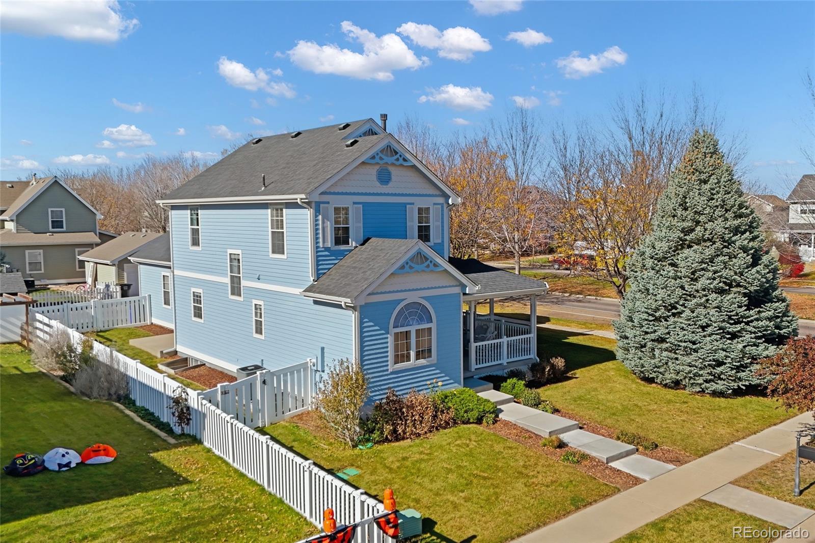 1229 Founders Circle Windsor, CO 80550 - Photo 42 of 45 a front view of a house with garden