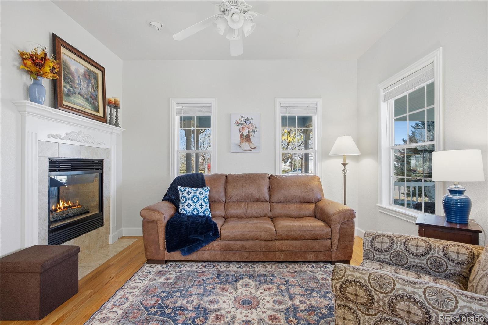 1229 Founders Circle Windsor, CO 80550 - Photo 5 of 45 a living room with furniture fireplace and rug