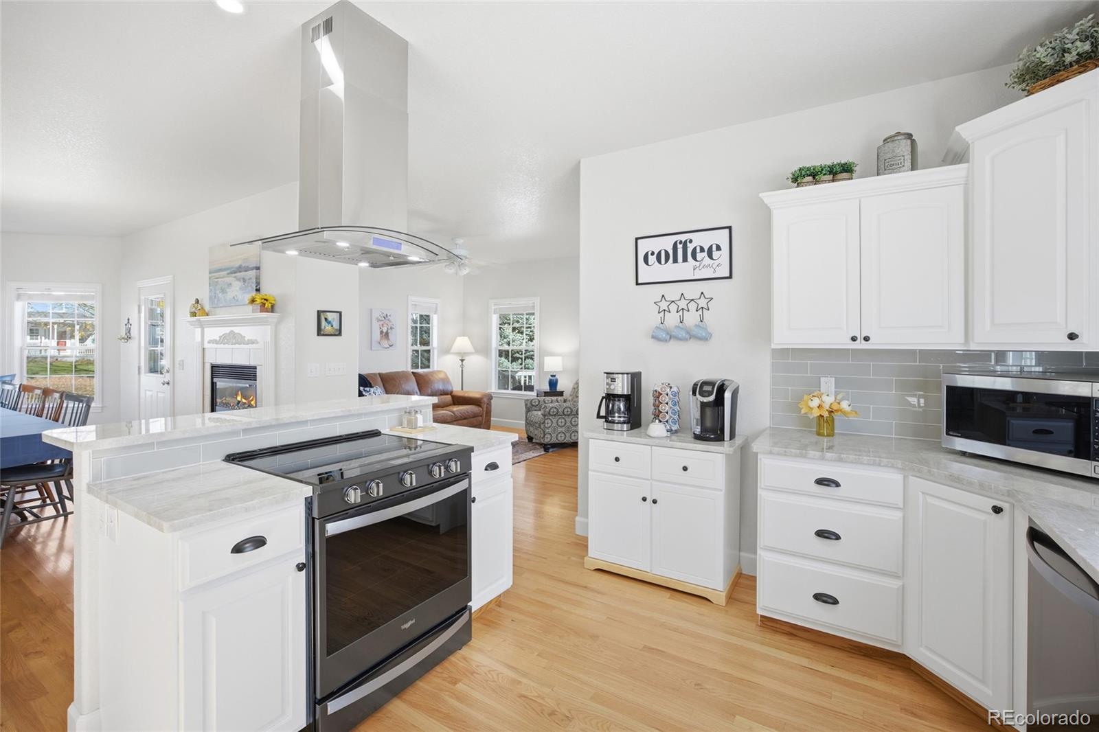 1229 Founders Circle Windsor, CO 80550 - Photo 8 of 45 a kitchen with stainless steel appliances granite countertop a stove and a sink