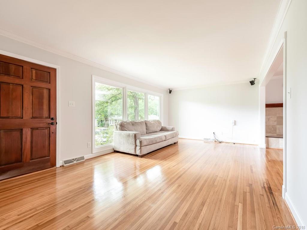 4801 Fairheath Road Charlotte, NC 28210 - Photo 2 of 25 a living room with stainless steel appliances furniture and a wooden floor