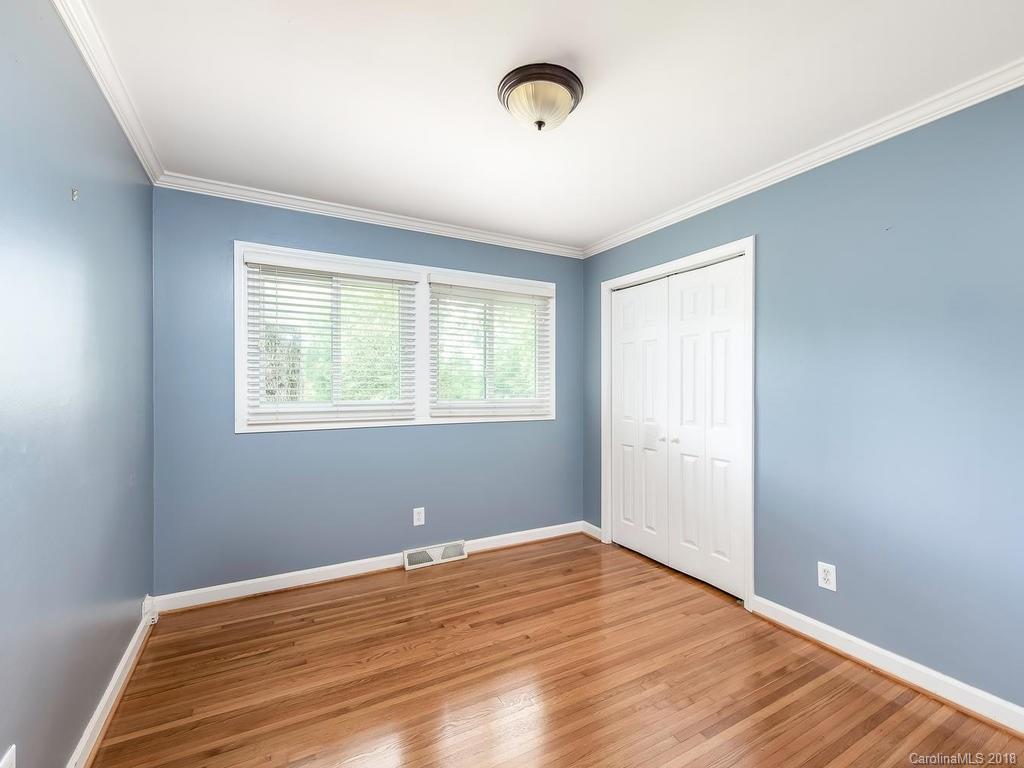 4801 Fairheath Road Charlotte, NC 28210 - Photo 17 of 25 a view of a room with wooden floor and windows