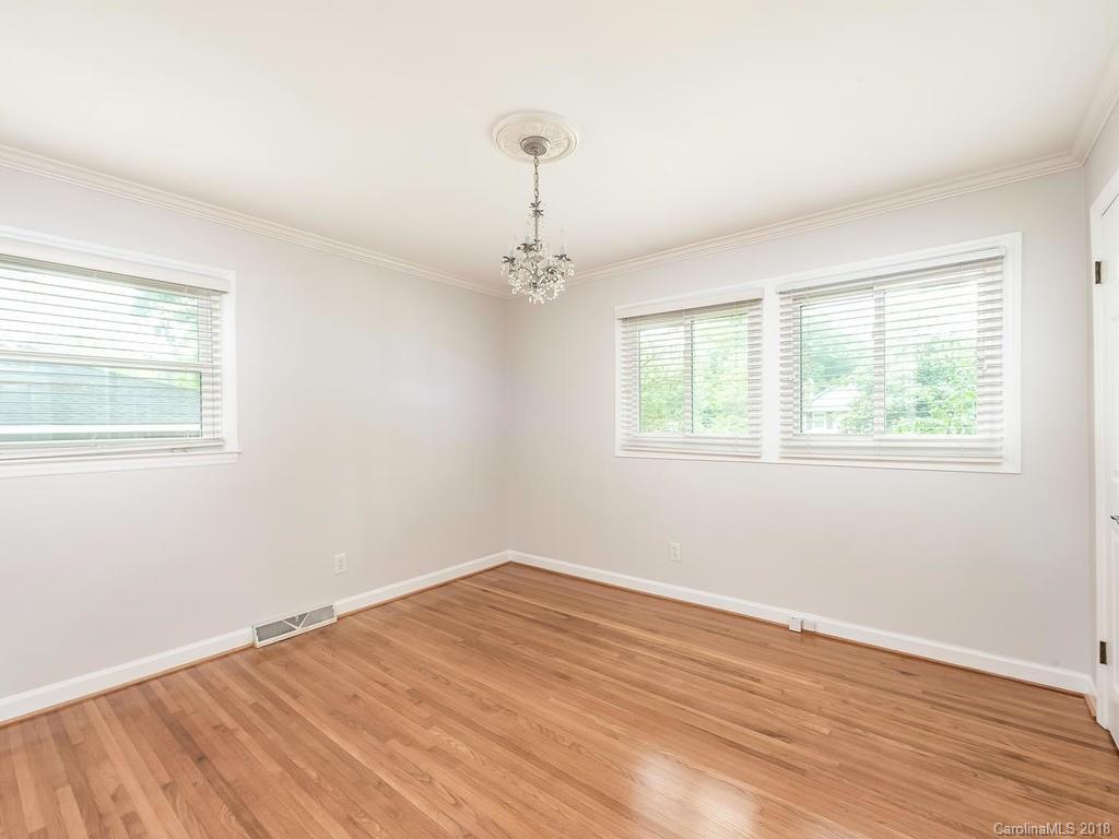 4801 Fairheath Road Charlotte, NC 28210 - Photo 18 of 25 a view of a room with wooden floor fan and windows