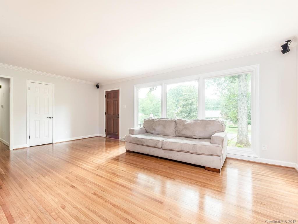 4801 Fairheath Road Charlotte, NC 28210 - Photo 3 of 25 a living room with furniture and a large window