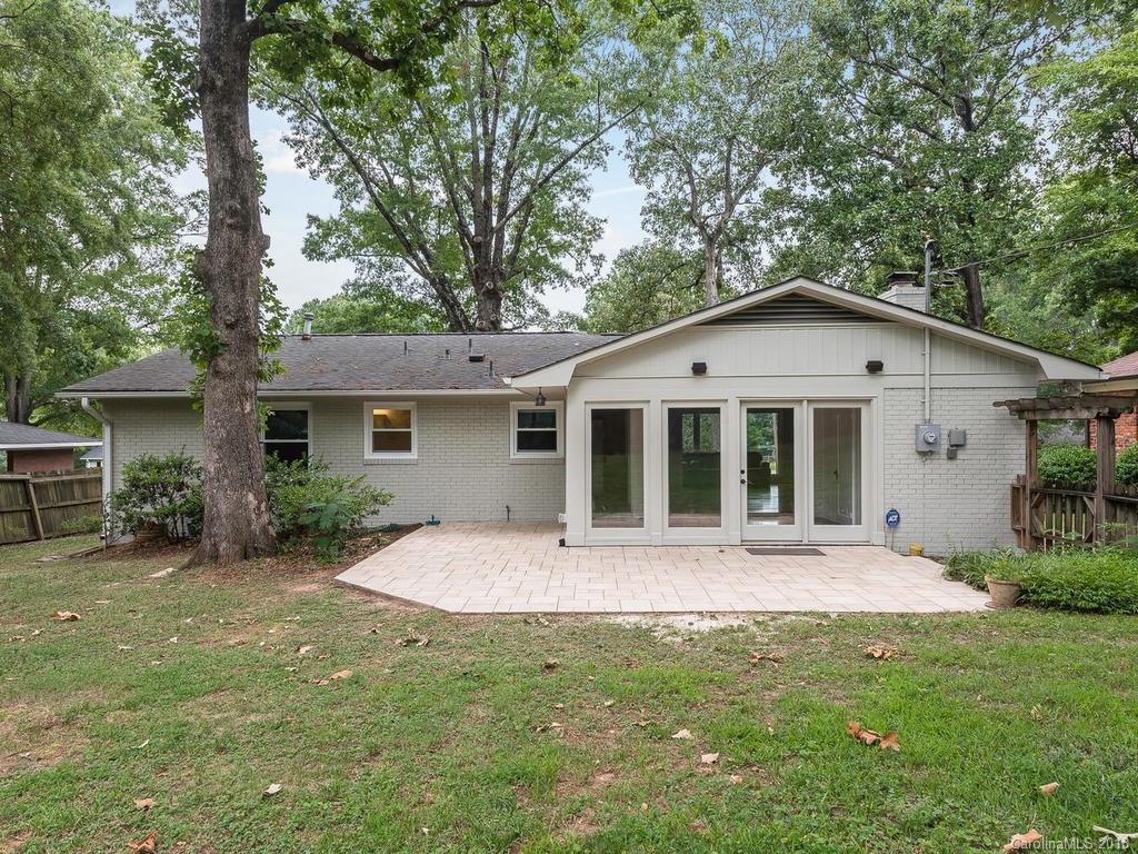 4801 Fairheath Road Charlotte, NC 28210 - Photo 22 of 25 a front view of a house with a garden
