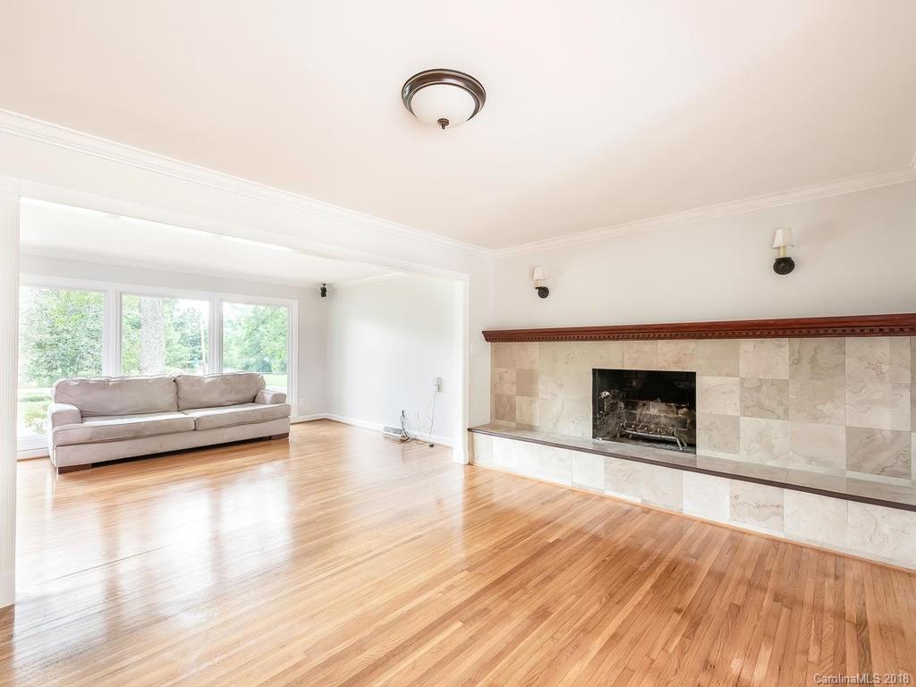 4801 Fairheath Road Charlotte, NC 28210 - Photo 5 of 25 a view of livingroom with furniture wooden floor and window