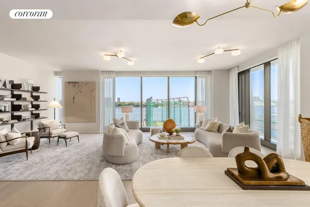 a living room with furniture and large windows