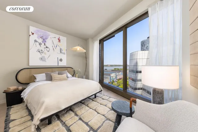 a bedroom with a bed and glass window