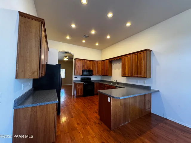 a kitchen with sink and cabinets