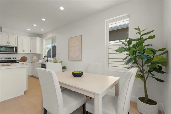 a view of a dining room with furniture window and outside view