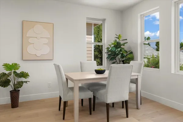 a kitchen with stainless steel appliances granite countertop a refrigerator a stove a sink a microwave and white cabinets