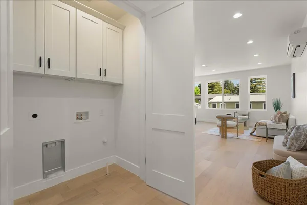 a bedroom with a bed and a potted plant