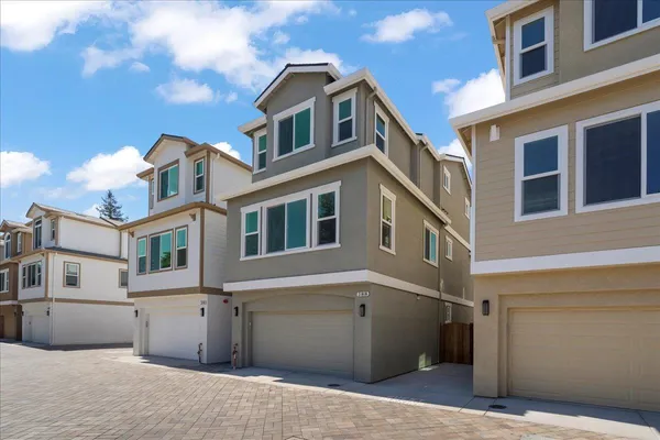 a front view of a house with a garage