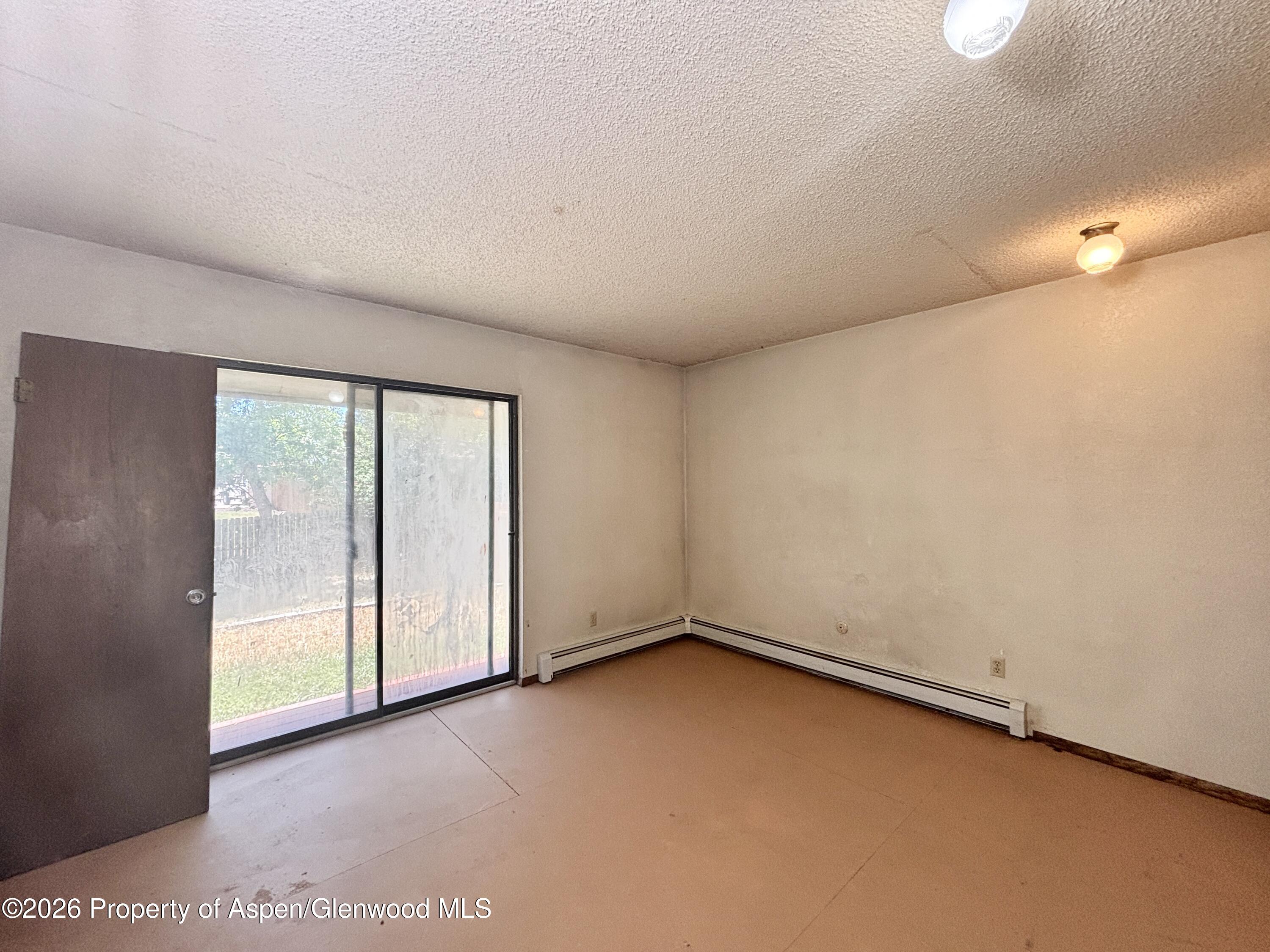 1623 West 7th Street Rifle, CO 81650 - Photo 6 of 21 an empty room with a empty space and a window