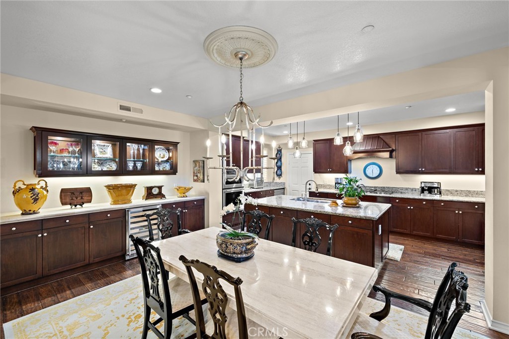 37 Tuscany Ladera Ranch, CA 92694 - Photo 12 of 53 a kitchen that has a table and chairs in it