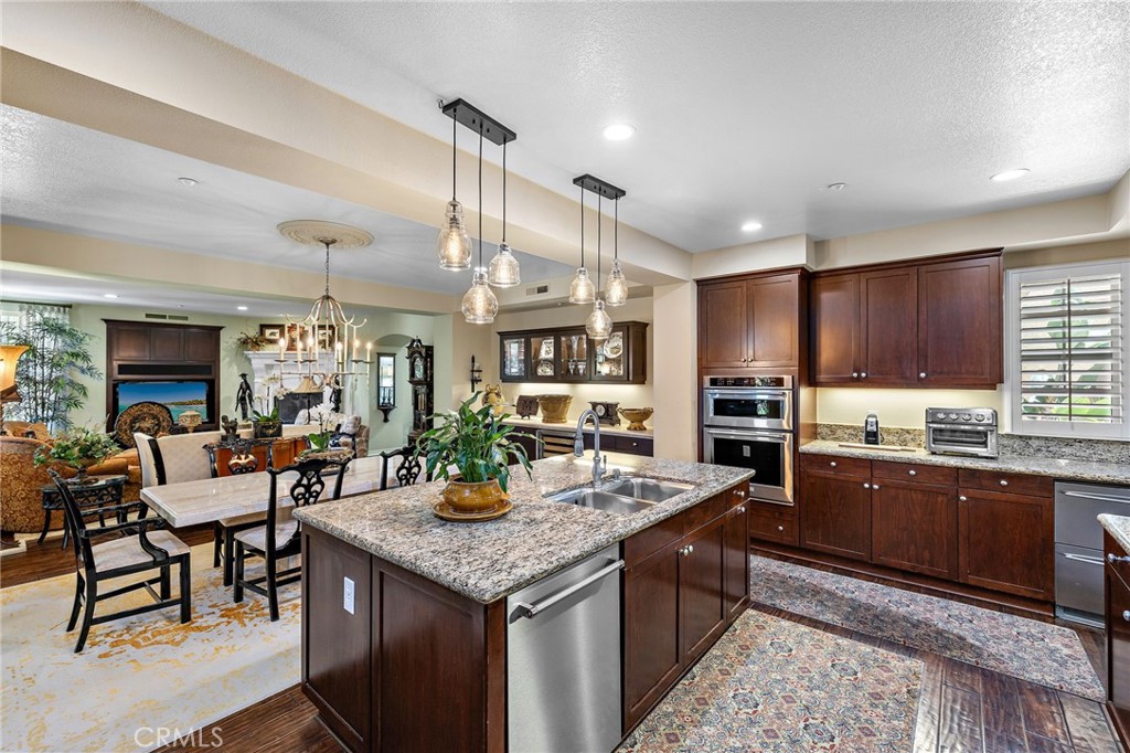 37 Tuscany Ladera Ranch, CA 92694 - Photo 16 of 53 a kitchen with granite countertop a sink and cabinets