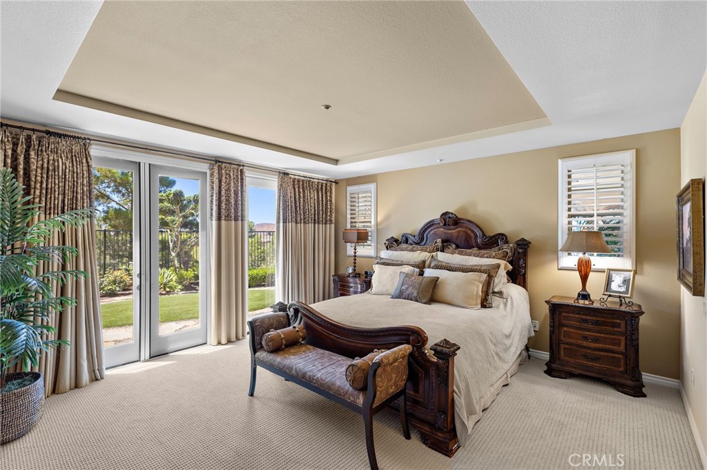 37 Tuscany Ladera Ranch, CA 92694 - Photo 22 of 53 a bedroom with a bed and wooden floor