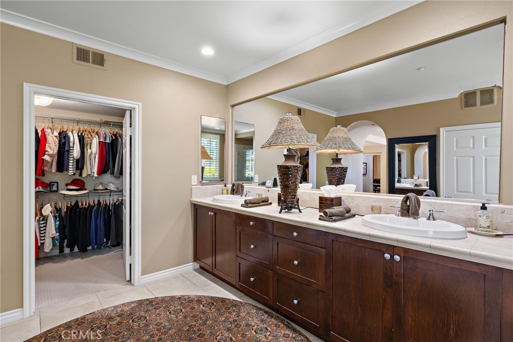 37 Tuscany Ladera Ranch, CA 92694 - Photo 25 of 53 a bathroom with a double vanity sink and a mirror