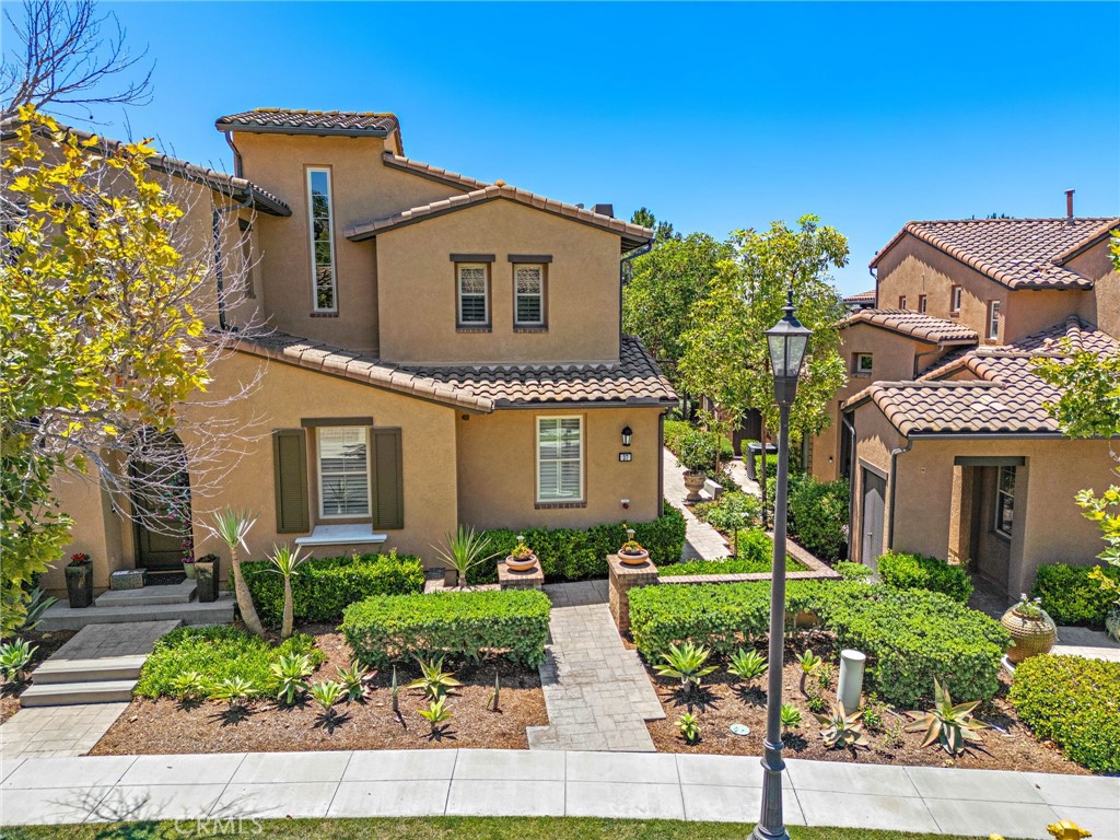 37 Tuscany Ladera Ranch, CA 92694 - Photo 36 of 53 a front view of a house with a garden